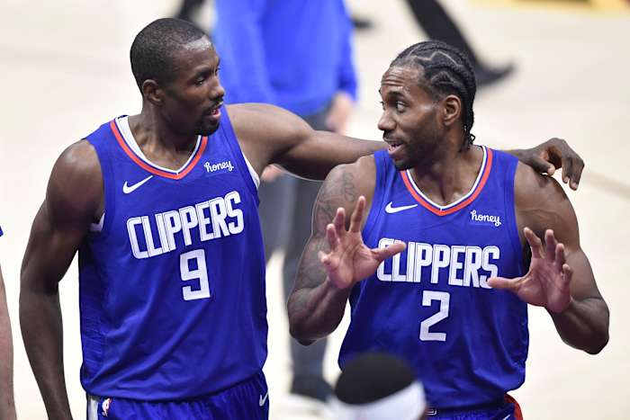 Feb 3, 2021; Cleveland, Ohio, USA; LA Clippers center Serge Ibaka (9) and forward Kawhi Leonard (2) walk to the locker room at halftime against the Cleveland Cavaliers at Rocket Mortgage FieldHouse. Mandatory Credit: David Richard-USA TODAY Sports
